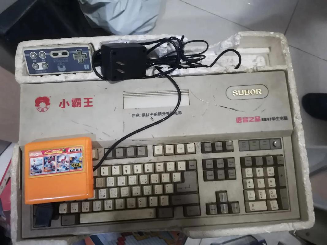 黑色手柄的小霸王_小霸王游戏机 魂斗罗 80后童年回忆